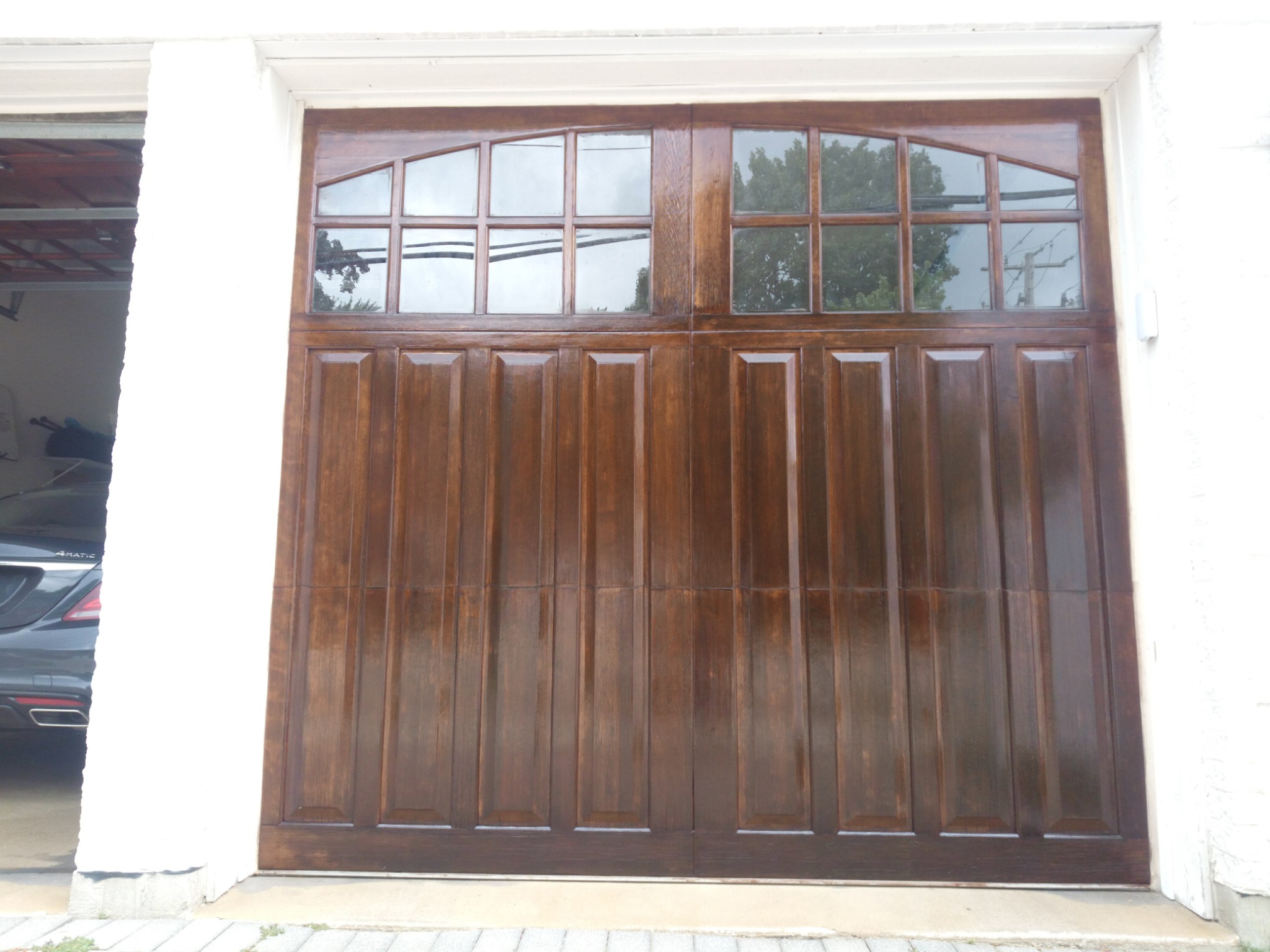 Wood garage door after refinishing